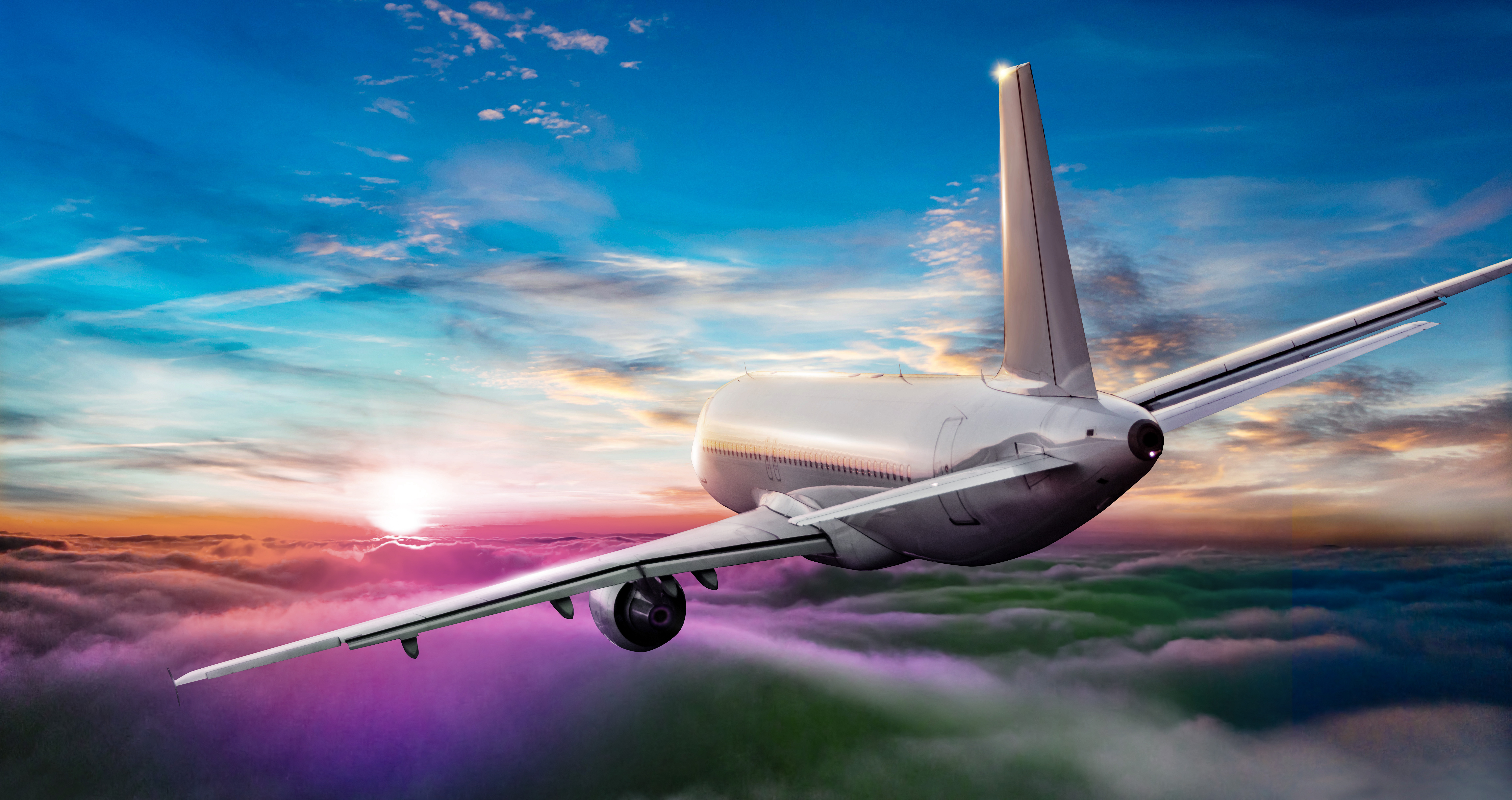Commercial,Airplane,Jetliner,Flying,Above,Clouds,In,Beautiful,Sunset,Light.